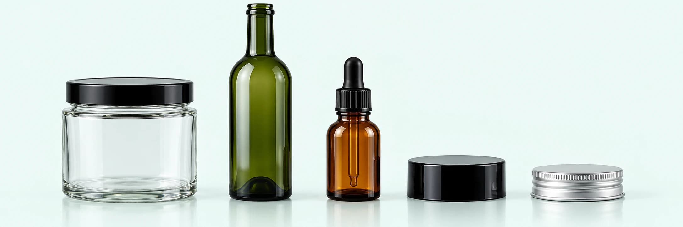 Stock glass jar, green wine bottle, amber dropper bottle and spare lids